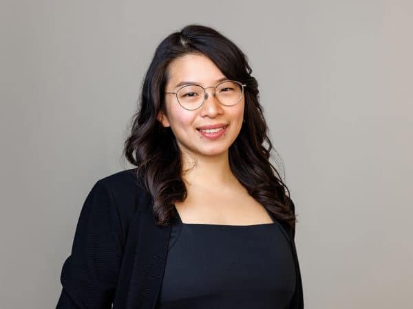 Cecilia Gee Lux Research Senior Analyst headshot wearing black.