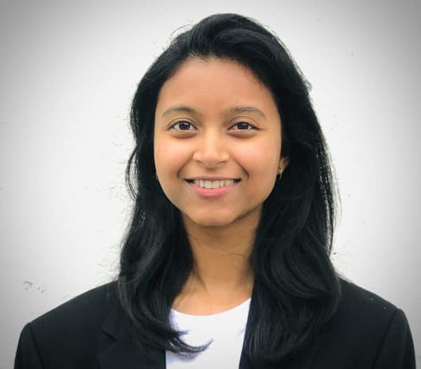 Urbi Pathak Lux Research Senior Research Associate headshot wearing a black blazer.