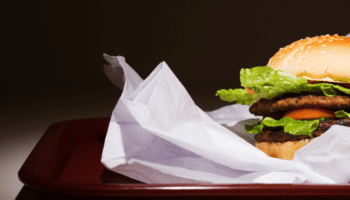 hamburger on a tray with wrapper