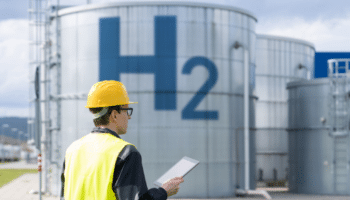 engineer with tablet on a background of hydrogen factory