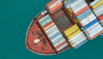 aerial image of cargo ship carrying containers