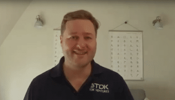 Nicolas Sauvage President of TDK Ventures Headshot wearing a collared shirt.