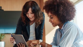 Women looking at iPad tablet