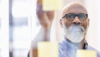 Man writing on sticky notes
