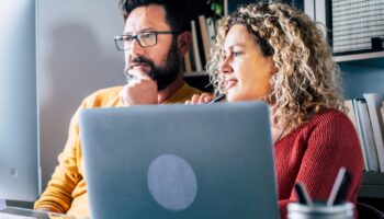 People looking at a computer