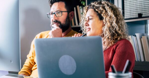 People looking at a computer