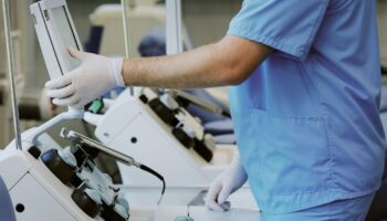Doctor using medical instruments