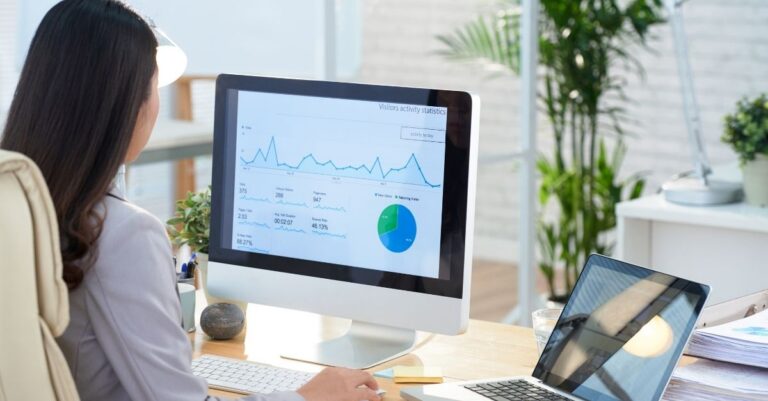 Woman looking at reports on a computer