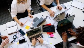 People gathered around a table in an office setting