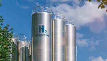 Silos with hydrogen against a blue sky