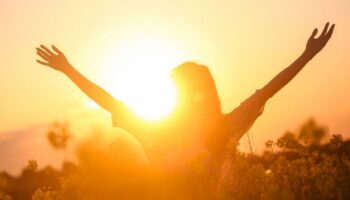 Silhouette of happy person against the sunset