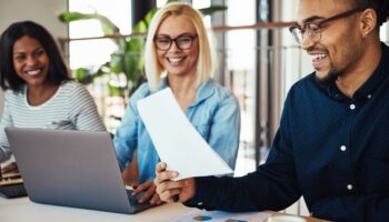 Smiling office workers at a table
