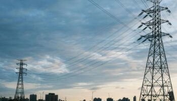 electric lines against a sunset